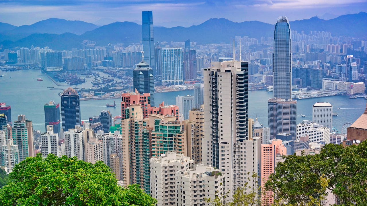 Explore the stunning cityscape of Hong Kong, showcasing skyscrapers and Victoria Harbour.